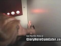 Slut enjoys sucking on gloryhole