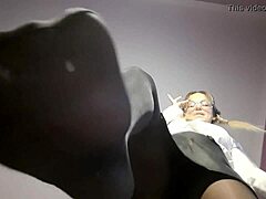 Nylon-clad mistress teases with foot fetish