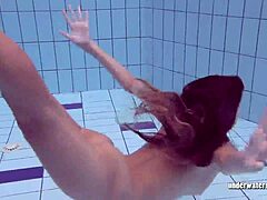 Hairy teen swims nude underwater