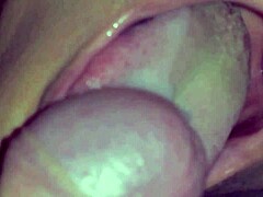 Close-up cumshot drip into her mouth