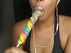 cute ebony chick sucking lollipop