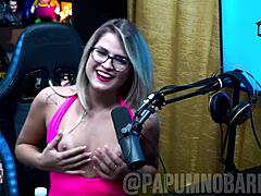 Bruna Carlos shows natural tits and arches ass for presenter.