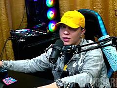 Bruna Carlos shows natural tits and arches ass for presenter.