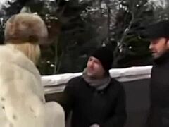 Snowy blonde prostitute serves two