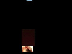 A beautiful woman broadcasts herself live on webcam, interacting with her audience in a sexy way.