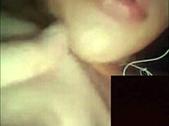 A beautiful woman broadcasts herself live on webcam, interacting with her audience in a sexy way.