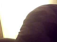 black performer gives a blow job in the scene with detailed focus on the act