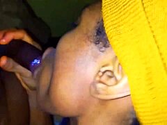 naija girl enjoys a refreshing sip during her oral presentation in a casual setting