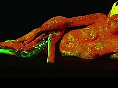 this glow in the dark goddess is masturbating with a dildo, she's so horny and fingering herself solo