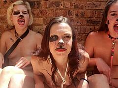 Outdoor threesome enjoys kinky tongue action