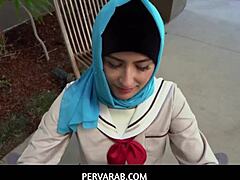 Hijab-clad Arab girl learns pleasure