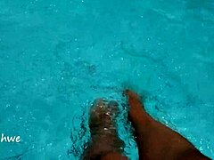 feet splashing playfully in pool with lots of water