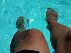 feet splashing playfully in pool with lots of water