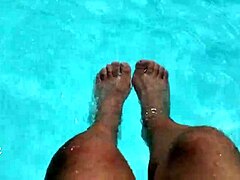 feet splashing playfully in pool with lots of water