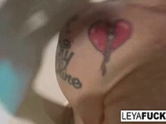 Leya Falcon enjoys the tub shower head on her ass