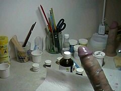 painting a prosthetic penis for an art project