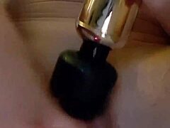 The greedy, pumped-up pussy of this amateur brunette milf squirts with excitement during intense masturbation