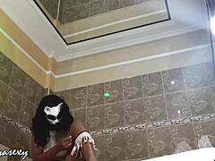 Ebony model with huge tits poses seductively