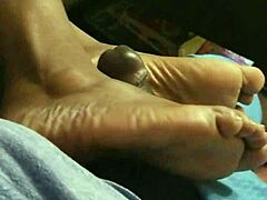 wife gives footjob