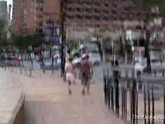 A young brunette participates in a scene involving oral and riding activities with two partners.