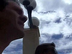 A young brunette participates in a scene involving oral and riding activities with two partners.