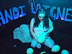 Cute milf Kandi Laigne enjoys balloon popping.