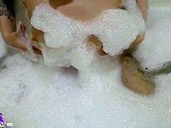 Cute babe sloppy sucks huge dildo in bath