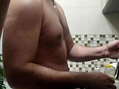 Macho guy bent over washing dishes 😏