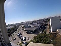 Sarada naked at hotel window near airport. Voyeur watches creampie scene.