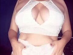 The hot latina milf dances in lingerie, teasing with her ass and boobs