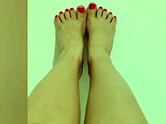 A cute girl teases with her sexy legs before fingering her wet, hairless hole at home