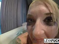 leya falcon uses the tub shower head on her ass. she moans in pleasure.