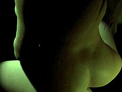 Beautiful plum girl rides dildo in the dark.