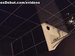 Girl in bathroom receives attention from guy