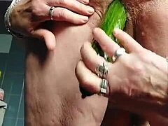 german granny fucks hairy pussy with cucumber