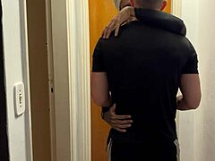 young guys kissing are caught on building camera