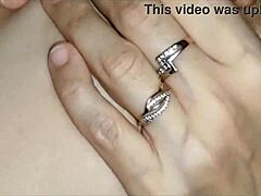 Husband gently stretches wife's body with fingers before intimate connection