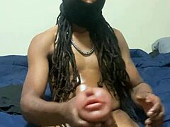 I'm PLAYING with a COUPLE of my TOYS, including a MONSTER COCK and BIG BLACK COCK for HANDJOB