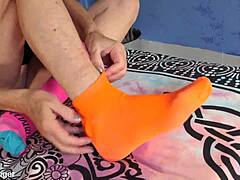 Anne explores her socs fetish with shaved tight pussy. Amateur feet play leads to mature tit teasing