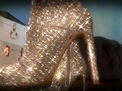 She mesmerizes her slave with sparkle boots