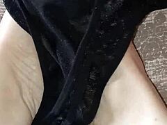 Alternative Ebony Beauty Rubs Thong on Bare Feet Sensually