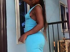 A crazy girl twerks wildly on the outdoor balcony