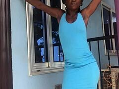 A crazy girl twerks wildly on the outdoor balcony