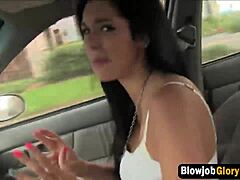 Brunette babe sucks long cock through gloryhole. Teen enjoys big tits oral action.