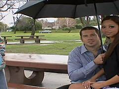 Attractive brunette in fishnets and heels engages with a partner on the bed, leading to a satisfying conclusion.