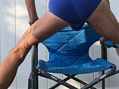 Deep pelvic stretching in blue briefs on blue chair late october 2024