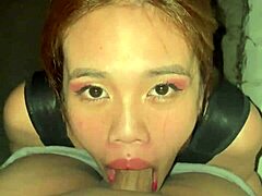 asian slut deepthroats on building rooftop.