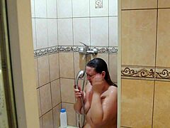 What happens when home cam catches chubby milf shaving in shower