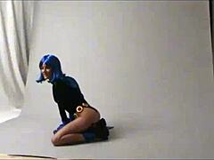 Teen amateur cosplays Raven outdoors in public