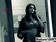 Brunette woman caught on hidden camera during private moments.